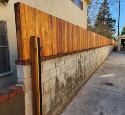 Wood Fence Atop Hollow Concrete Block Wall Built Correctly in the Los Angeles Area